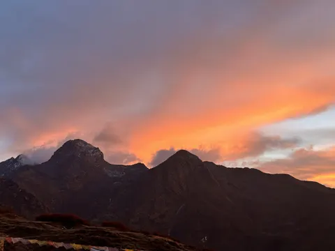 Two dark, rugged mountain summits stand against a sunset sky 4K Wallpaper · nature · 3840×2880