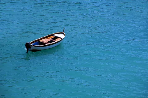 Boat at Sea 4K Wallpaper · ocean · 3840×2560