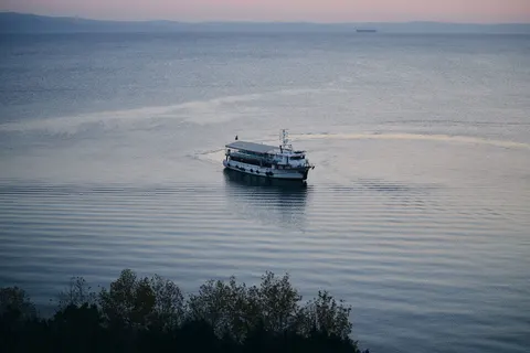 Boat at Sea 4K Wallpaper · ocean · 3840×2560