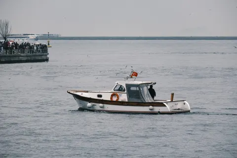 Boat at Sea 4K Wallpaper · ocean · 3840×2561