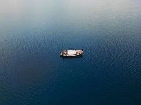 Boat at Sea 4K Wallpaper · ocean · 3840×2880